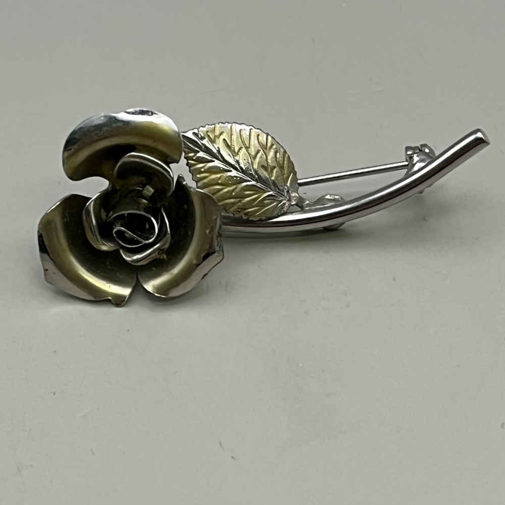 Silver and Gold Floral Brooch with Leaf Accent
